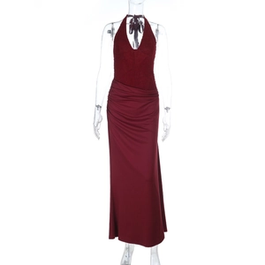 Detail view of burgundy halter neck evening dress with lace top and slim fit knit fabric
