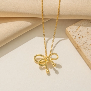 Golden bow pendant necklace on elegant snake chain with polished gold plating