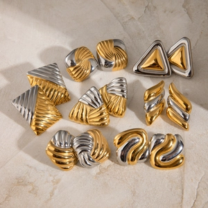 Two-tone geometric stainless steel earrings with square and fan shapes on stone background