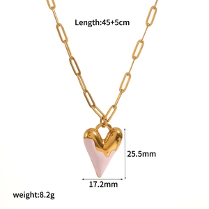 Detail view of 18k gold heart necklace with dimensions 25.5mm and weight 8.2g labels