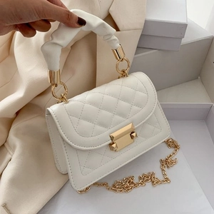 Chic white quilted crossbody bag with gold chain strap and elegant ruched handle