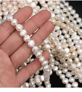 Macro shot of 9-10mm creamy white baroque freshwater pearls for DIY jewelry making