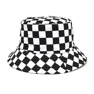 Close-up of black and white checkerboard bucket hat showing cotton fabric texture