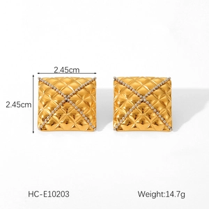 Close-up of gold square stud earrings with quilted pattern and white beads, 2.45cm size