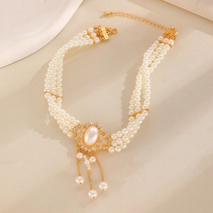 French vintage multi-layer pearl bracelet with golden metal accents and tassels