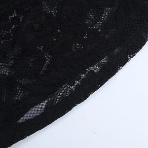 Close-up of intricate black floral lace pattern with delicate mesh hollow-out texture