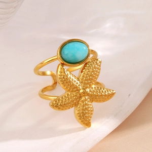 Gold ocean themed open ring featuring a blue sea stone and detailed starfish element