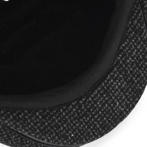 Close-up of fine stitching and fleece lining detail on middle-aged men's winter cap