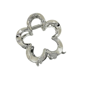 Minimalist silver clover metal hair claw clip with elegant hollow design for women