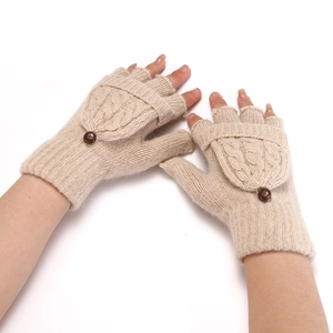 Close-up of beige knitted fingerless gloves with a practical flip-top cover and brown button