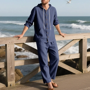 Detail view of deep blue linen hoody shirt with wooden buttons and matching beach pants
