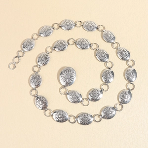 Vintage silver metal waist belt with engraved daisy floral patterns and hook clasp