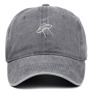 Macro view of UFO embroidery on washed dark grey vintage cotton baseball cap