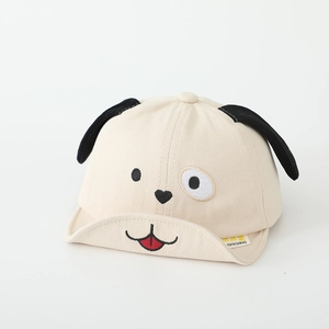Detailed view of beige cotton baby cap with cartoon dog face and 3D long puppy ears