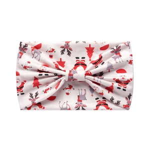 Detail of Christmas headband with Santa and reindeer patterns and a large bow tie