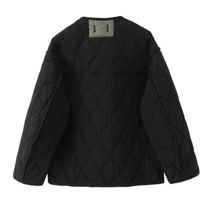 Black quilted lightweight jacket for women featuring a minimalist back patch design