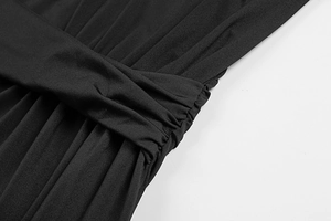 Detailed macro shot of the twisted knot and ruched fabric on this black slim dress