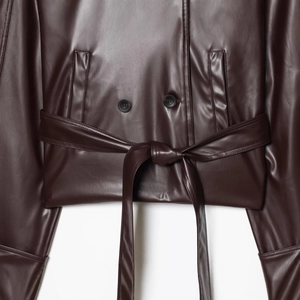 Short double-breasted PU leather jacket in deep brown with waist belt and button details