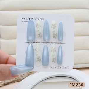Handmade almond cat eye press-on nails with blue-grey finish and 3D silver flowers