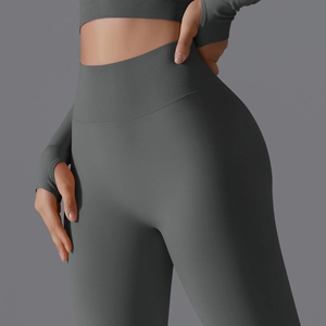 Detail view of high waist seamless yoga pants with ribbed waistband and thumbhole sleeves