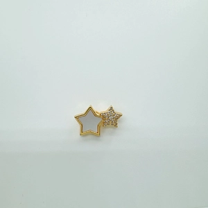 Macro detail of gold-plated star pendant featuring white pearl shell and pavé cubic zirconia