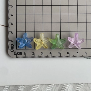 Detail showing 2cm acrylic starfish beads with gradient glitter for DIY jewelry making