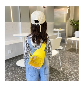 Detailed back view of a yellow kid's chest bag with a glitter-filled transparent window