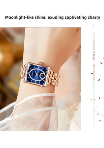 Detail of rose gold square watch with blue sunray dial and crystal hour markers