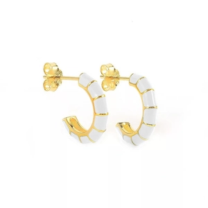 Detail showing the polished gold finish with white enamel segments and S925 silver hallmark