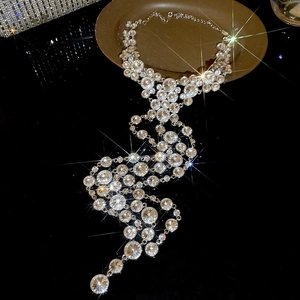 Close-up of sparkling rhinestone tassel necklace with elegant silver finish and star effect