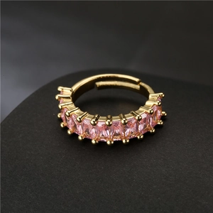 Adjustable gold plated open ring with rectangular pink zircon stones in a side view