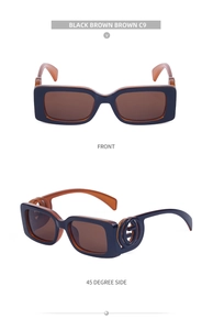 Detail view of rectangular sunglasses with amber frames and golden circular logo accents