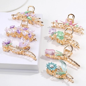 Elegant gold alloy floral hair claws with enamel flower and pearl details in six designs