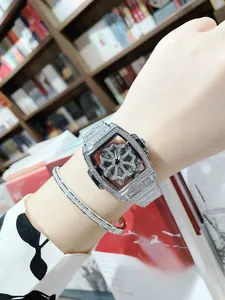 Close-up of luxury silver tonneau watch with rotating dial and matching diamond bracelet