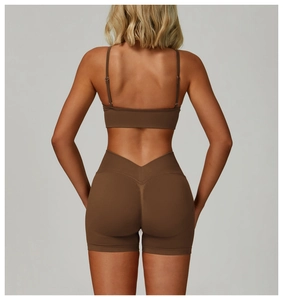 Detail view of coffee brown fitness set featuring V-shaped high waist yoga shorts