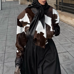 Women's faux fur cow print short jacket with stylish black leather neck straps