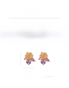 Detailed specs of flower earrings with champagne glass petals and sparkling crystals