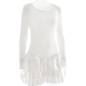 Detail view of white long sleeve dress with layered ruffle hem and slim crew neck