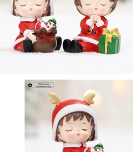 Détails macro de figurines de Noël en résine peintes à la main en tenues rouges