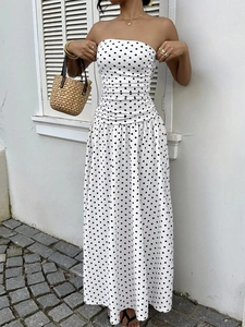 Detail of high-waist pleated design on white polka dot off-shoulder A-line dress