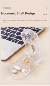 Close-up of portable pill cutter with metal blade, V-slot and two storage compartments