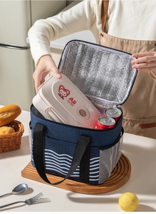 Close-up of insulated lunch bag with thick aluminum foil lining and wavy stripe pattern