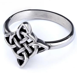 Detailed side view of vintage silver Viking Celtic knot ring with hollow out metal patterns