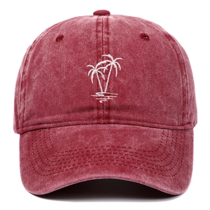 Vintage washed burgundy baseball cap featuring white coconut tree embroidery on the front