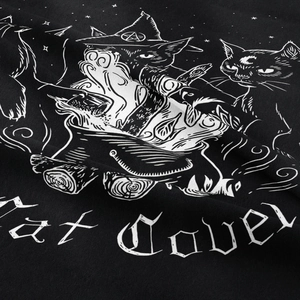 Detailed close-up showing the fine fabric texture and gothic black cat coven print