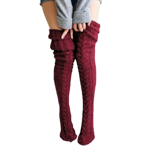 Thigh-high cable knit leg warmers in deep wine red color for autumn and winter warmth