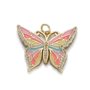 Pendentif papillon exquis en métal doré avec ailes en émail rose et strass brillants