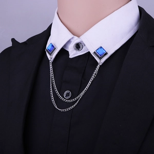 Detail of square blue stone collar chain pins with double silver tassel on white shirt