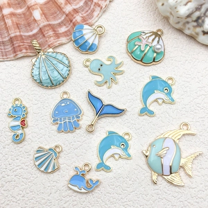 Blue ocean theme DIY metal charms set featuring dolphin starfish and jellyfish designs