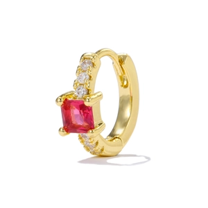 Detail of gold hoop earring with square red ruby zircon and small white diamonds